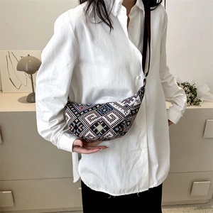 Ethnic bohemian canvas crossbody bag with colorful geometric patterns in a half-moon shape