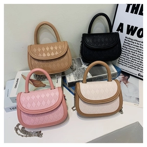 Collection of four saddle bags in khaki, black, pink, and beige with quilted pattern details