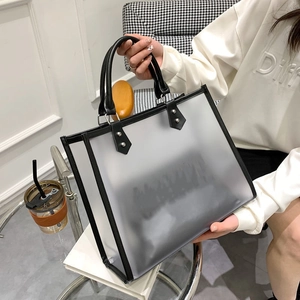 Frosted semi-transparent tote bag with black leather trim and rivet details for daily use