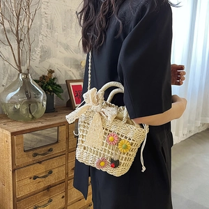 French straw bucket bag with floral lace bows for beach vacations and shoulder carry