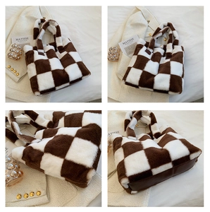Macro details of brown and white checkered plush tote bag with reinforced faux leather base