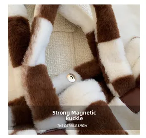 Detail of the strong magnetic buckle on the fluffy brown and white checkerboard bag