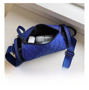 Top view of blue quilted nylon bucket bag showing spacious interior for daily essentials