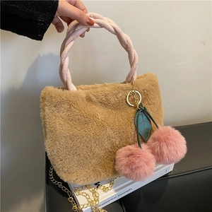Plush camel bucket bag with pink woven handle, cherry charm and gold metal chain