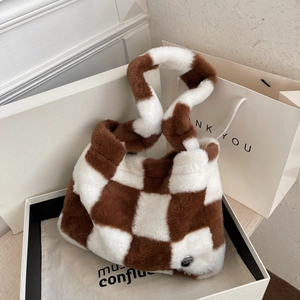 Furry heart-shaped handbag with brown and white checkerboard pattern in soft plush fabric