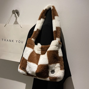 Chic brown and cream checkerboard faux fur tote bag with a metallic logo detail