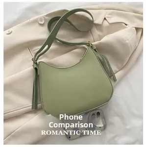 Size comparison of light green PU hobo bag with adjustable strap and side tassel detail