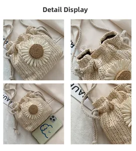 Detail view of straw woven bucket bag with daisy decor and phone size comparison