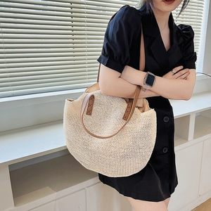 Large capacity woven straw tote bag with brown leather handles for summer beach outings