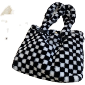 Fuzzy checkerboard laptop tote bag for women featuring soft black and white plush fabric