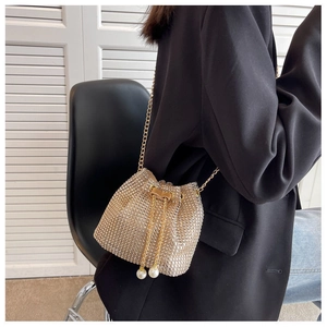 Sparkling rhinestone bucket bag with pearl drawstring tassels and gold chain strap