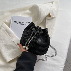 Elegant black rhinestone bucket bag with pearl drawstring and silver chain strap