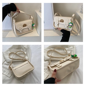 Cream white crossbody bag with cartoon embroidery and doll pendant in four split views