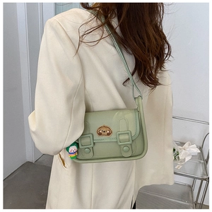 Detail of light green PU leather crossbody bag featuring a cute puppy embroidery patch