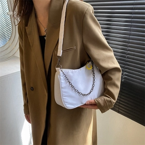 Minimalist white nylon dumpling bag with adjustable strap and chain detail for women