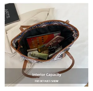 Internal capacity of large canvas tote bag showing storage for iPad and cosmetics