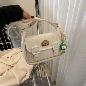 Chic cream white PU leather crossbody bag with cute bear embroidery and dinosaur charm