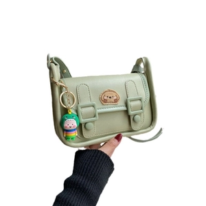 Matcha green PU leather crossbody bag with cute bear patch and dinosaur keychain