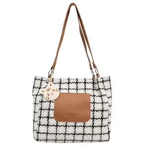 Classic black and white plaid tote bag with brown leather accents and a cute cat charm