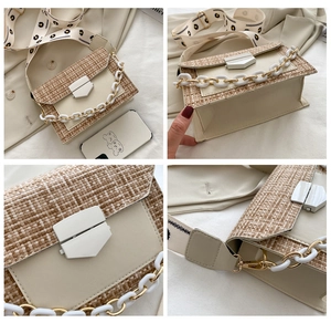 Detail view of cream crossbody bag featuring tweed flap and patterned wide strap