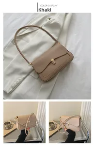 Close-up of khaki retro saddle bag with golden metal rotating buckle detail