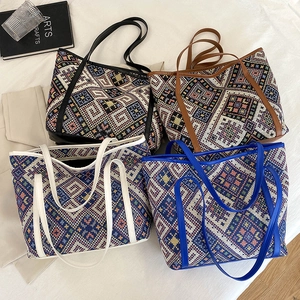 Set of large knit tote bags with ethnic geometric patterns in four stylish colors