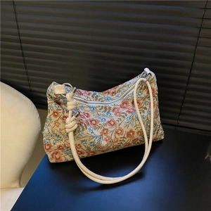 Vintage floral jacquard shoulder bag with cream straps and decorative knots