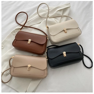 Flat lay of retro minimalist saddle bags in four colors on a white blazer background