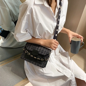 Plaid weave and black leather crossbody bag with daisy strap and metal chain detail