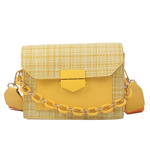 Bright yellow woven crossbody bag with resin chain and orange contrast wide strap