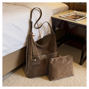 Detail view of retro coffee brown suede tote bag set with matching zipper pouch and texture