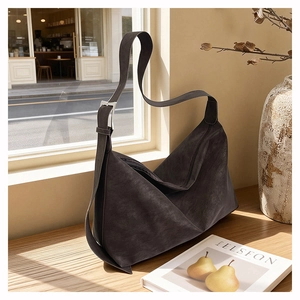 Minimalist large charcoal grey suede tote bag with wide strap and silver buckle