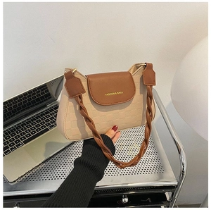 Detailed view of beige checkered shoulder bag with brown woven strap and logo text