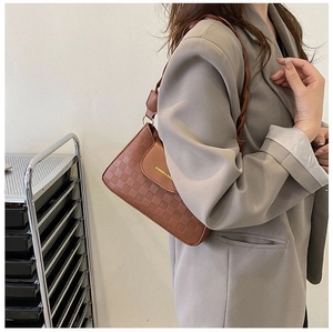 Brown PU leather baguette bag with checkered embossing and a woven strap detail