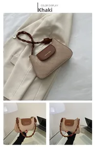 Detail view of khaki checkered shoulder bag with woven strap and FASHION & BAGS text