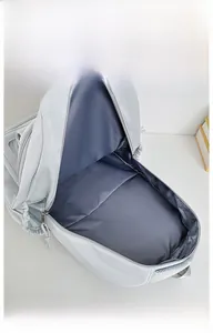 Macro view showing the large internal storage space and gray lining of the backpack