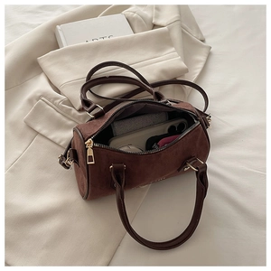 Internal view of a retro matte Boston bag showing capacity for phone and accessories