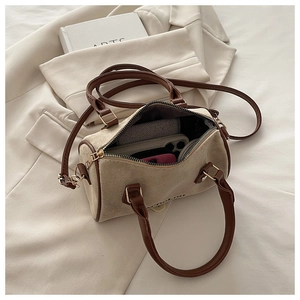 Top view of retro Boston bag with khaki suede texture and spacious inner storage