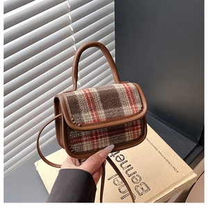 Detail of mini plaid crossbody bag with brown PU leather trim and retro wool texture