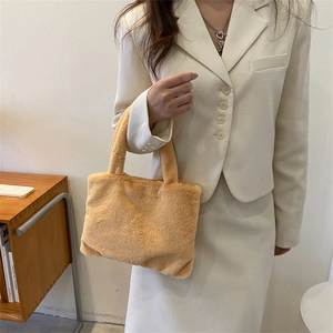 Minimalist orange plush handbag with soft faux fur texture for women’s fashion