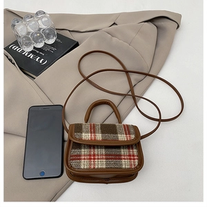 Mini plaid crossbody bag detail with brown leather trim and retro check wool fabric