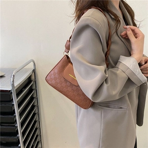 Chic brown checkerboard shoulder bag for women with woven strap and gold hardware