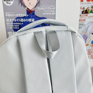 Light gray large capacity nylon backpack with reinforced handle and breathable mesh strap