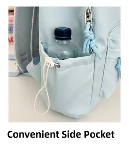 Detail of light blue backpack side pocket with adjustable white drawstring buckle