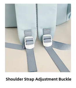 Close-up of the adjustable shoulder strap buckle on the light blue nylon backpack