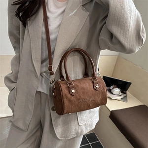 Brown suede Boston shoulder bag with top handles and adjustable strap for women