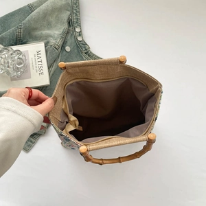 Large capacity floral canvas tote bag with bamboo handle and interior zipper pocket
