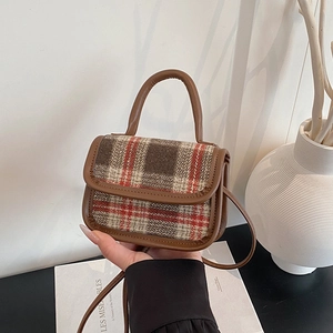 Retro plaid crossbody bag with brown leather trim and top handle in a minimalist style