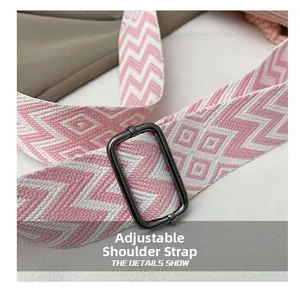 Close-up of pink and white geometric jacquard adjustable corduroy tote bag strap