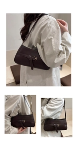 Macro detail of dark brown underarm bag with decorative leather belt and metal buckle